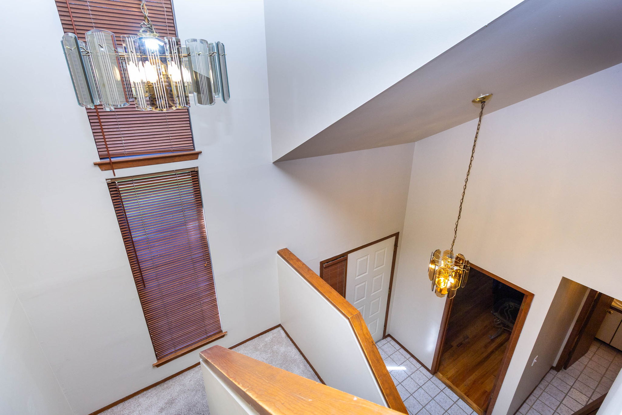 Open stairway with two-story foyer