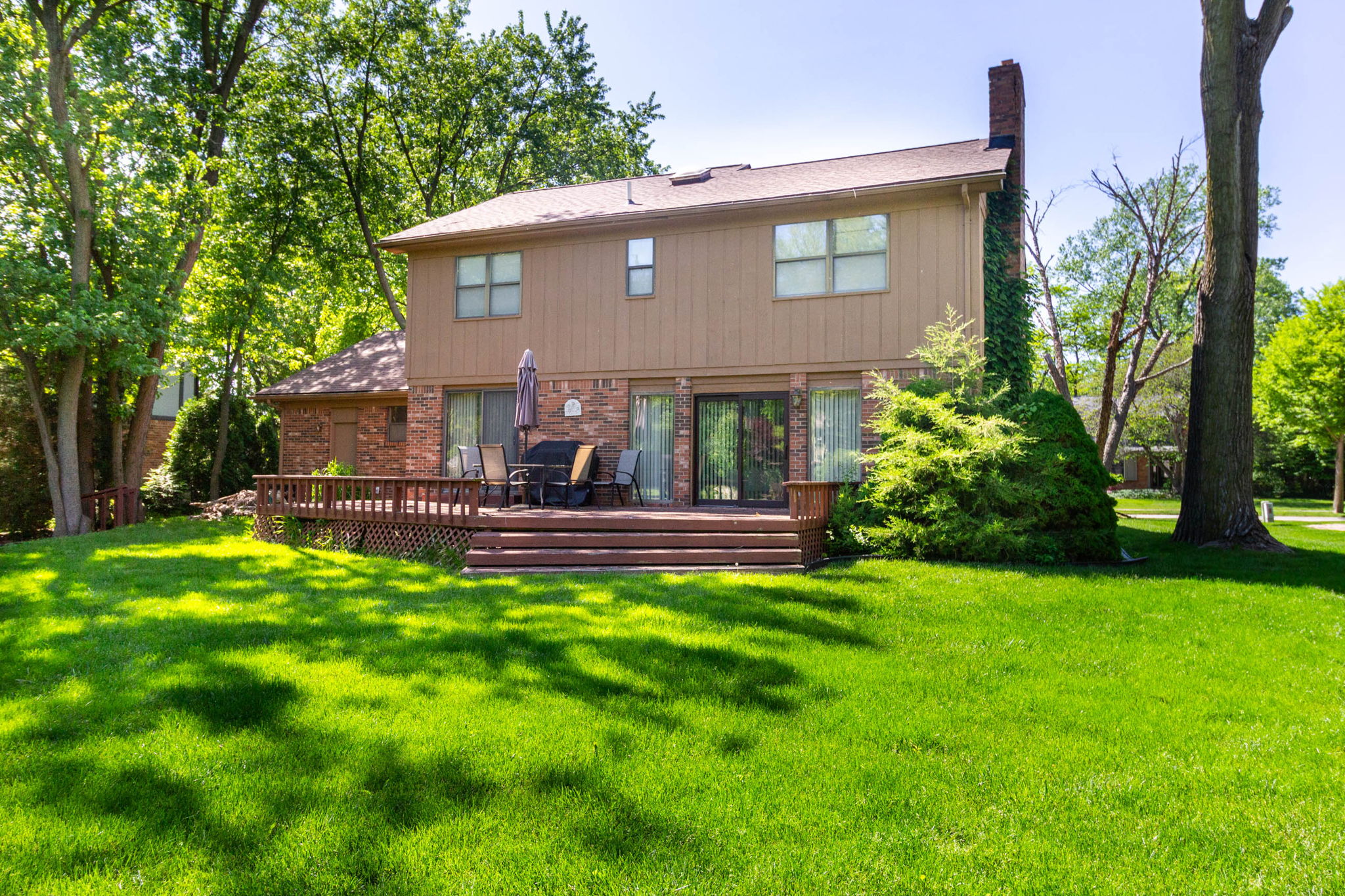 Rear of the home with deck