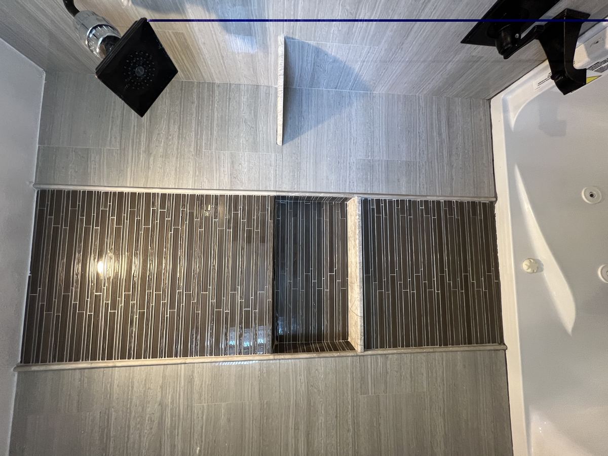 Main bathroom — dual sinks with marble countertop and large mirror