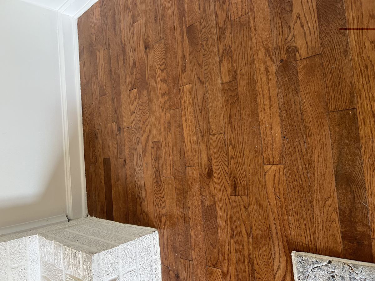 Rich engineered hardwood flooring detail in living area
