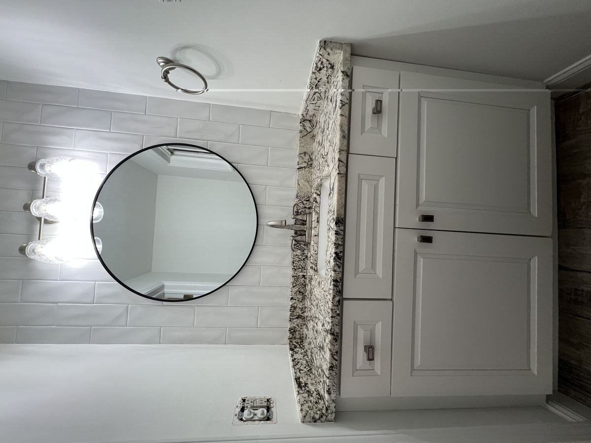 Half bath — powder room with granite vanity and updated lighting