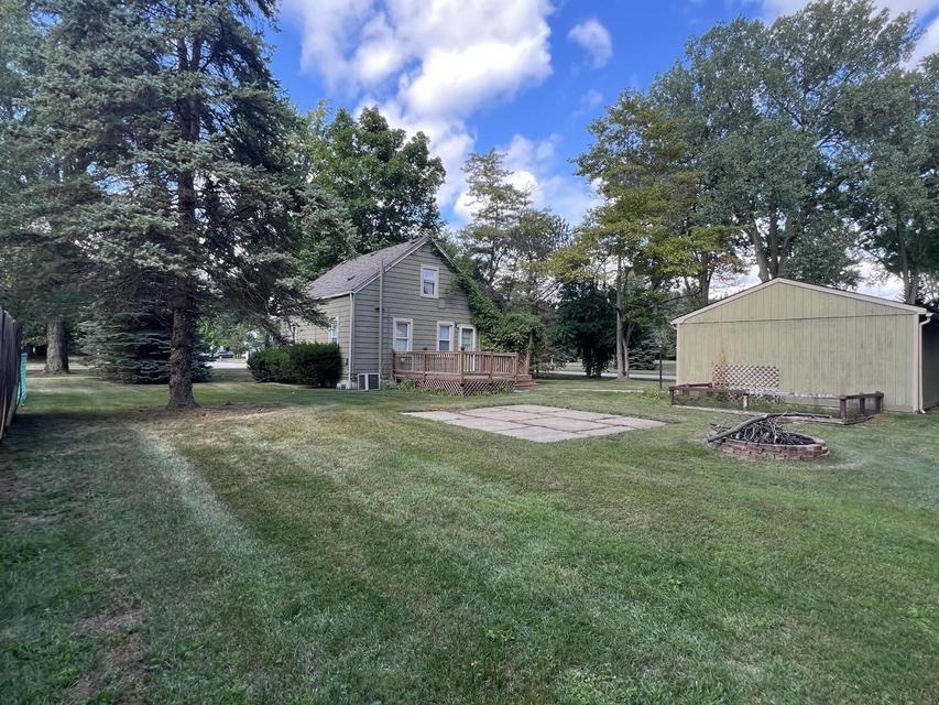 Backyard with fire pit and shed