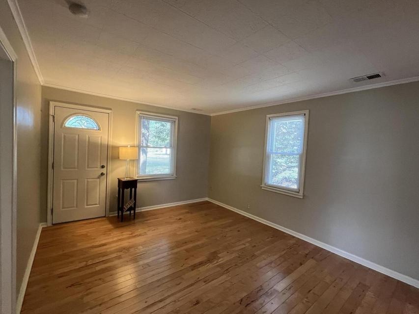 Living room with front entry door